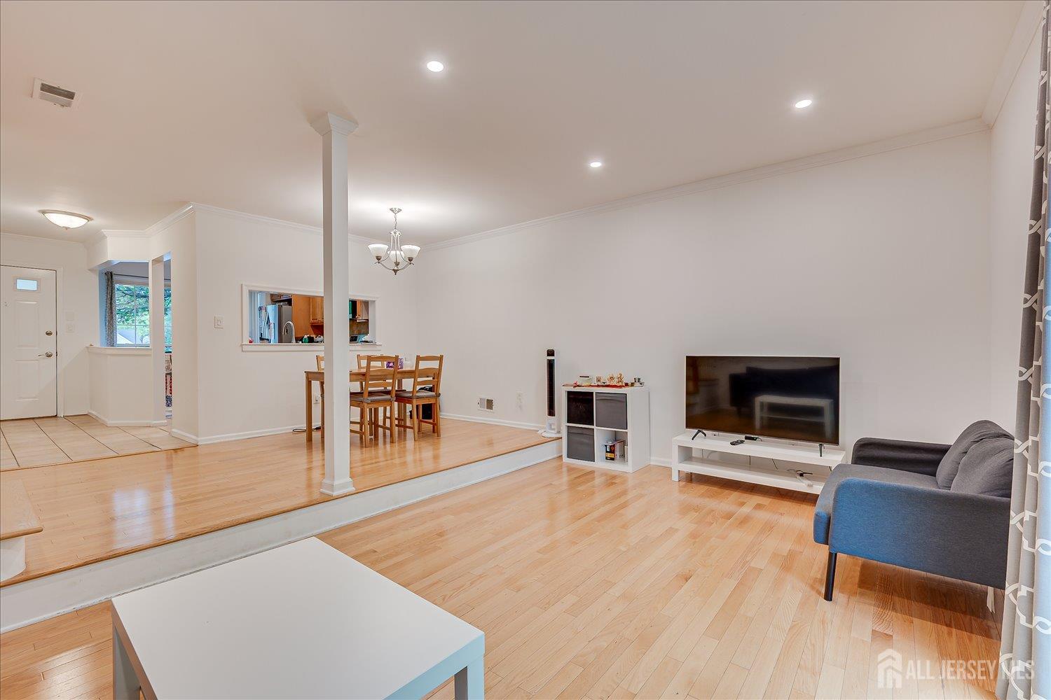 903 Maplecrest Road Edison, NJ 08820 - Photo 8 of 24 a living room with furniture and a flat screen tv