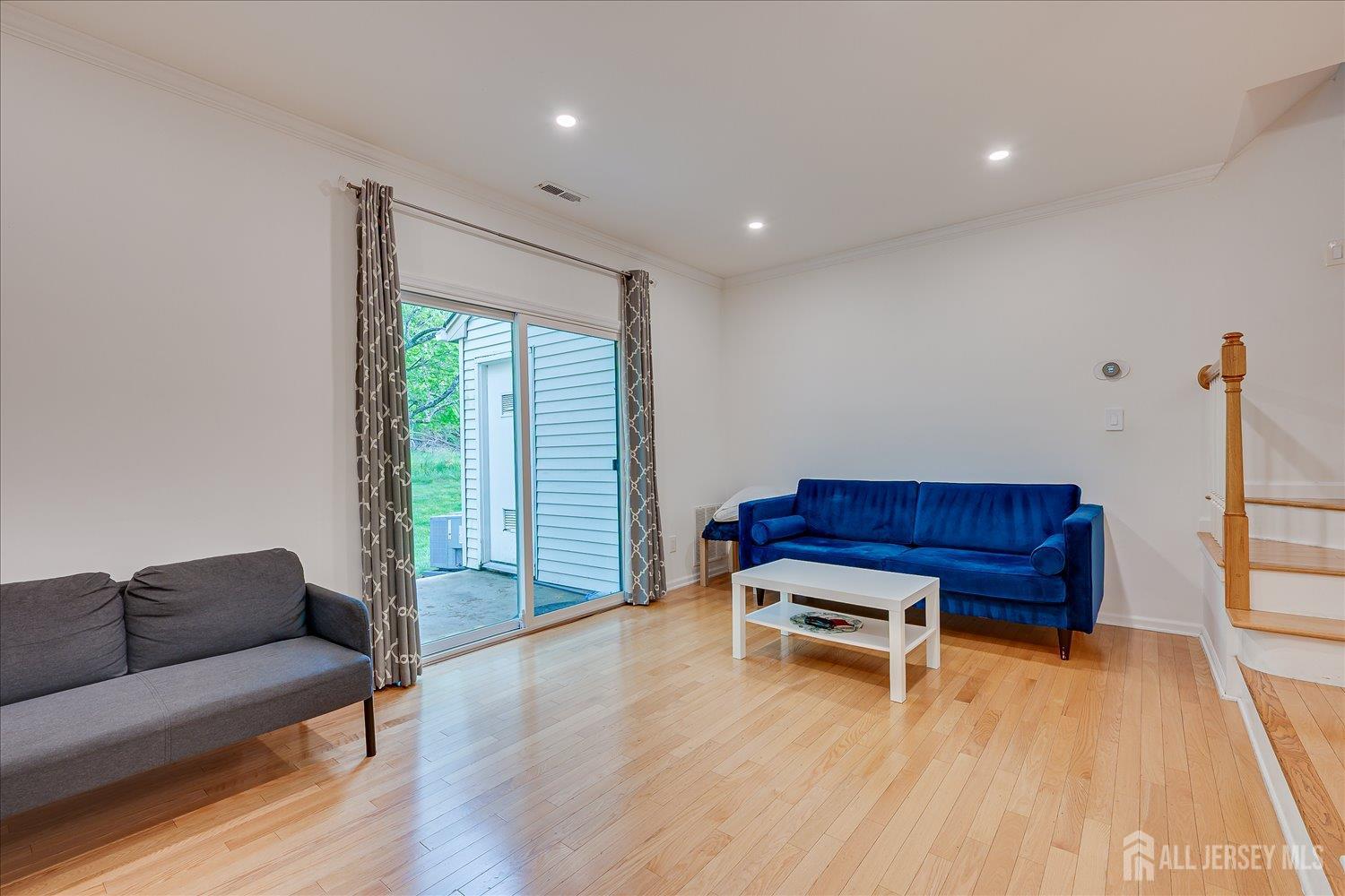 903 Maplecrest Road Edison, NJ 08820 - Photo 9 of 24 a living room with furniture and a wooden floor
