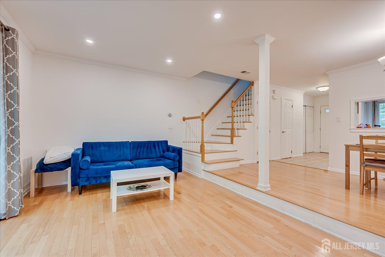 903 Maplecrest Road Edison, NJ 08820 - Photo 10 of 24 a living room with furniture and a table with wooden floor