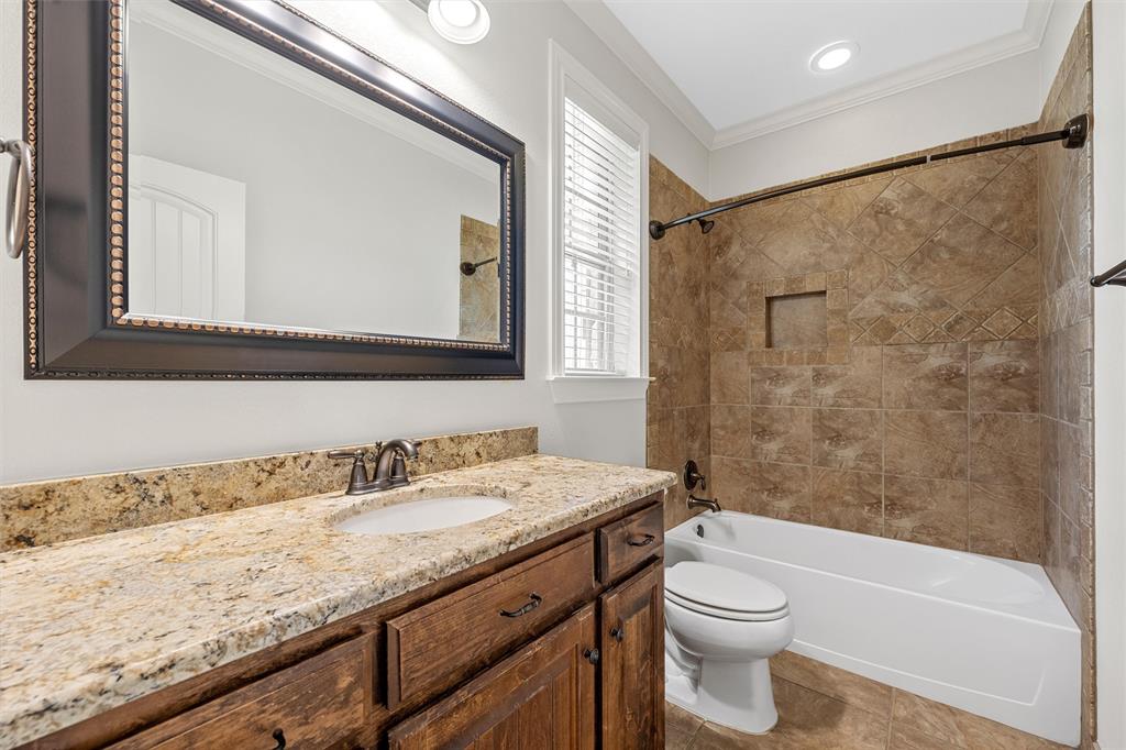144 Ellis Farm Road Hewitt, TX 76643 - Photo 21 of 36 Bathroom vanity with a granite countertop and an undermount sink