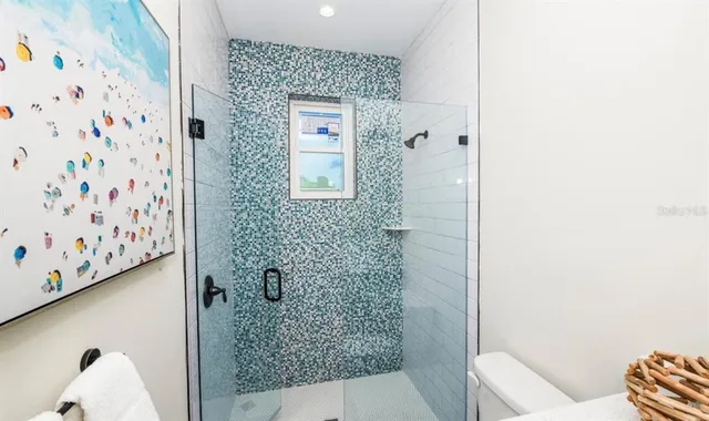 a bedroom with a bed and a lamp