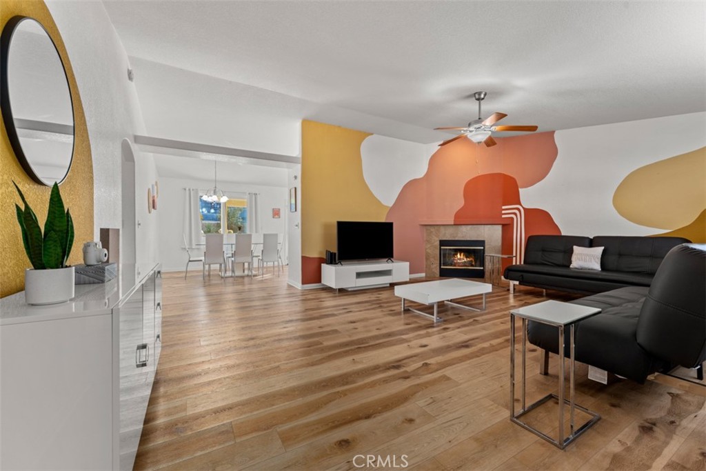 60205 Latham Trail Joshua Tree, CA 92252 - Photo 14 of 38 a living room with furniture a fireplace and a potted plant