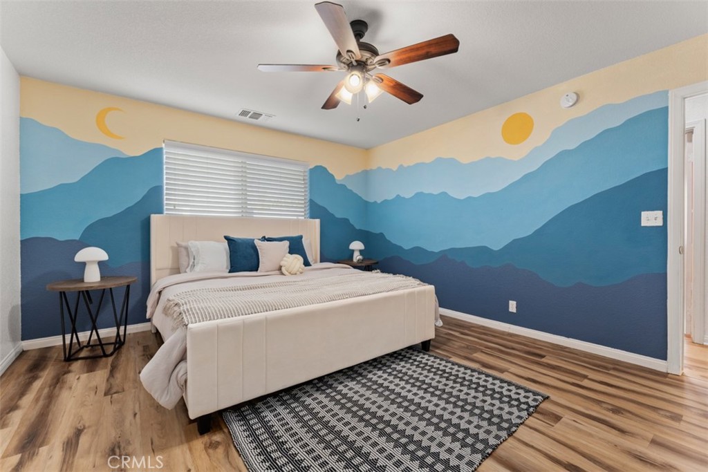 60205 Latham Trail Joshua Tree, CA 92252 - Photo 17 of 38 a bedroom with a bed and window