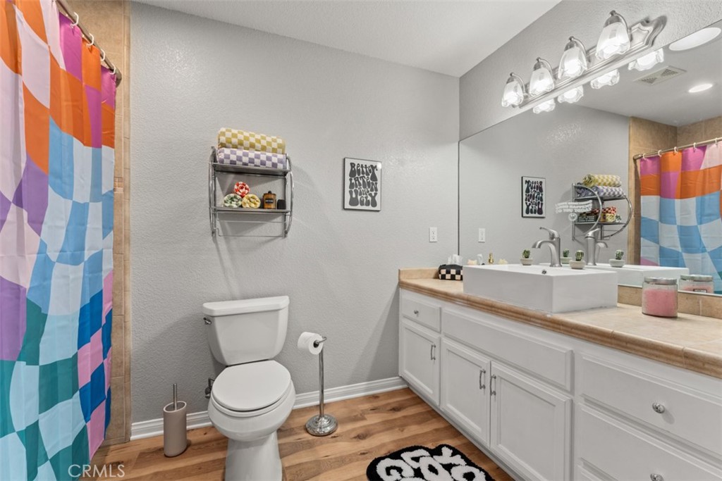 60205 Latham Trail Joshua Tree, CA 92252 - Photo 21 of 38 a bathroom with a toilet sink and mirror