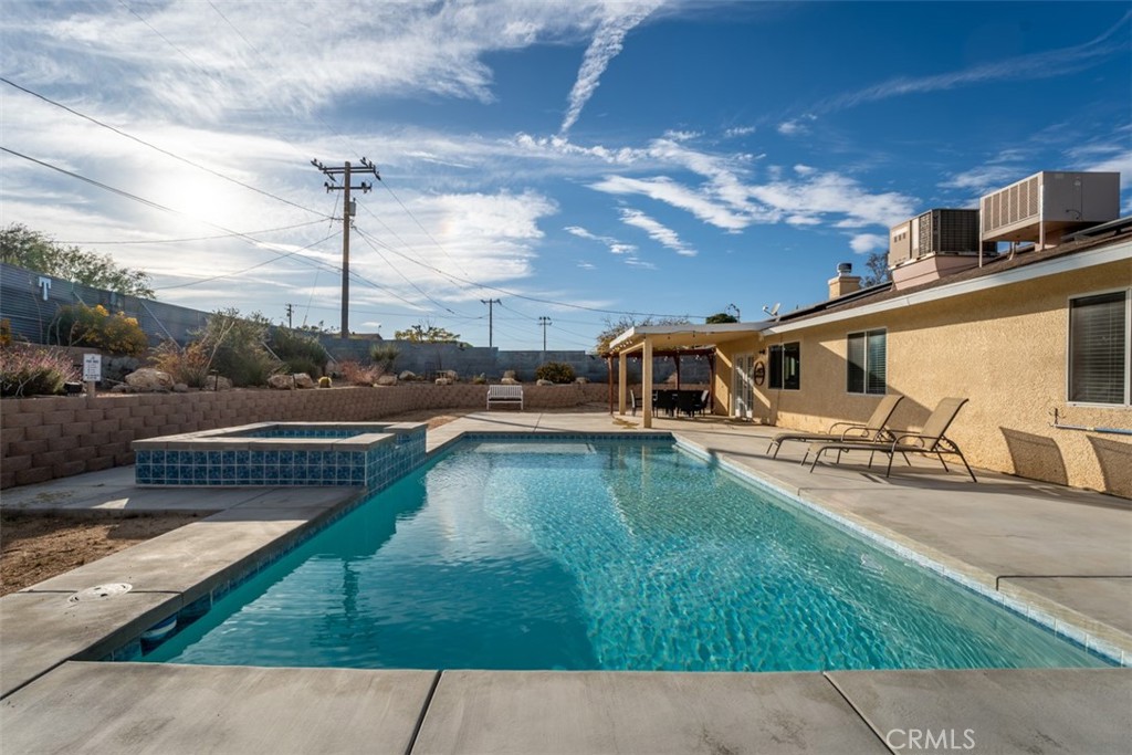 60205 Latham Trail Joshua Tree, CA 92252 - Photo 27 of 38 a house view with swimming pool