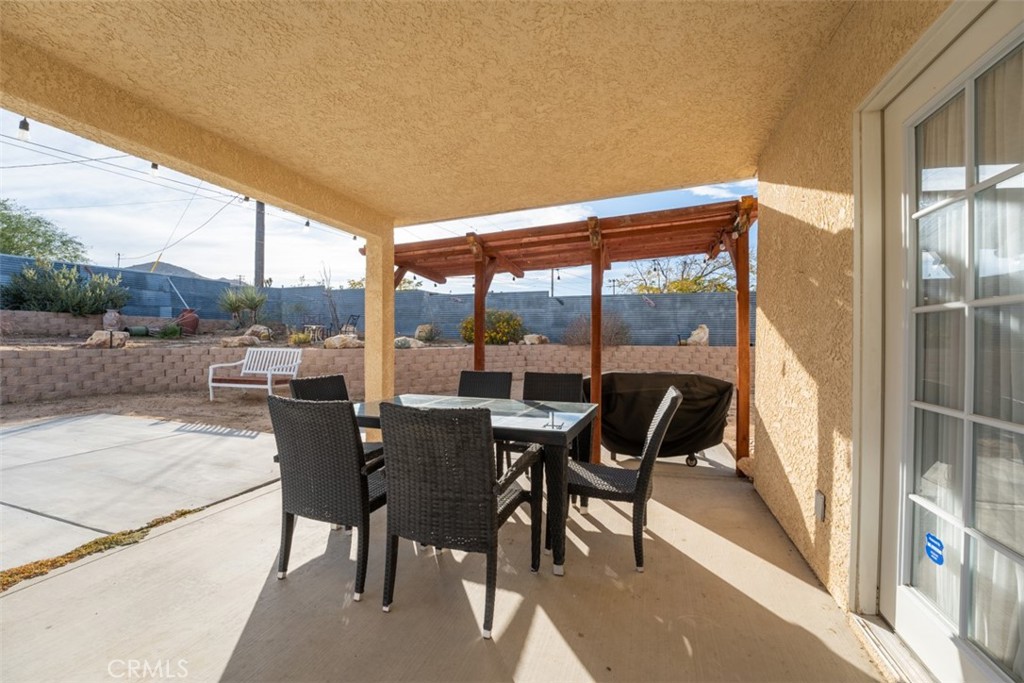 60205 Latham Trail Joshua Tree, CA 92252 - Photo 30 of 38 a view of a dining room with furniture and window