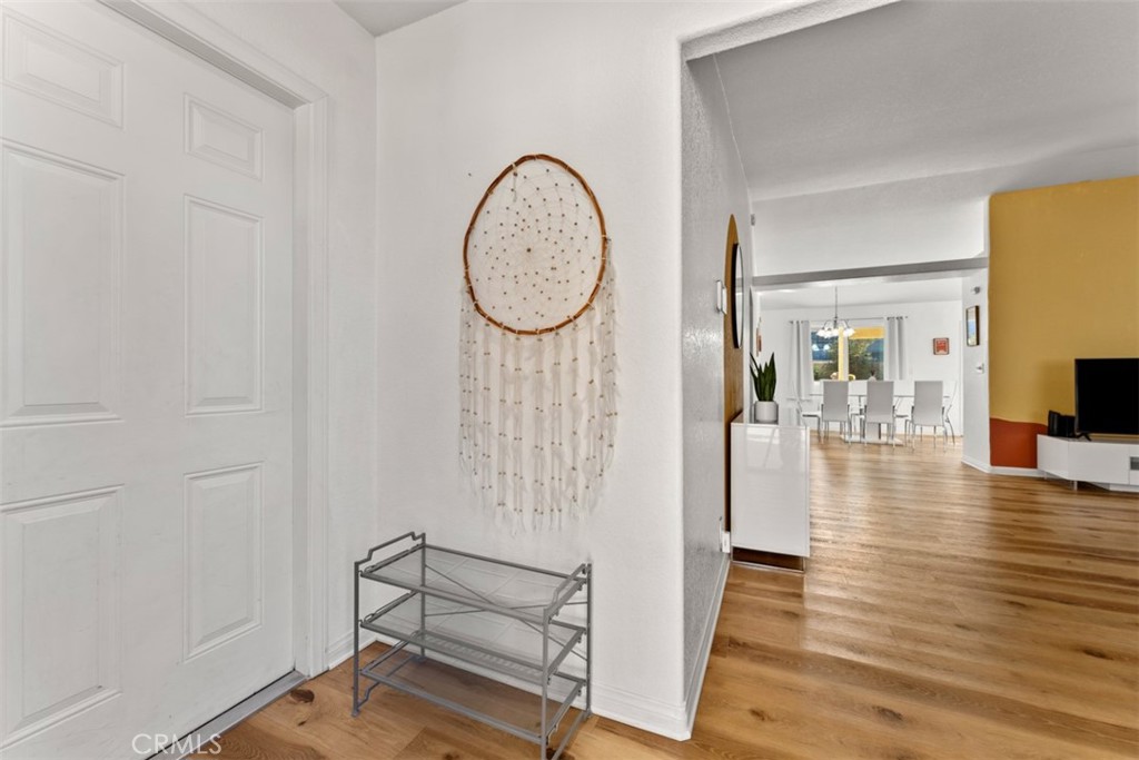 60205 Latham Trail Joshua Tree, CA 92252 - Photo 5 of 38 a view of a hallway with wooden floor