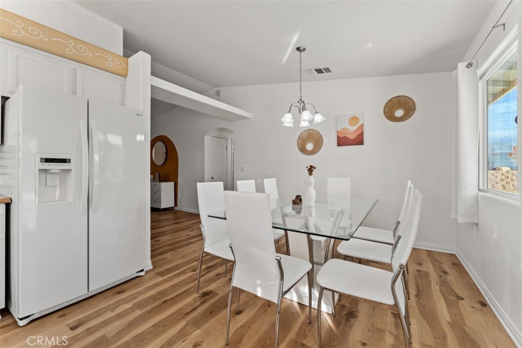60205 Latham Trail Joshua Tree, CA 92252 - Photo 10 of 38 a view of a dining room with furniture and chandelier