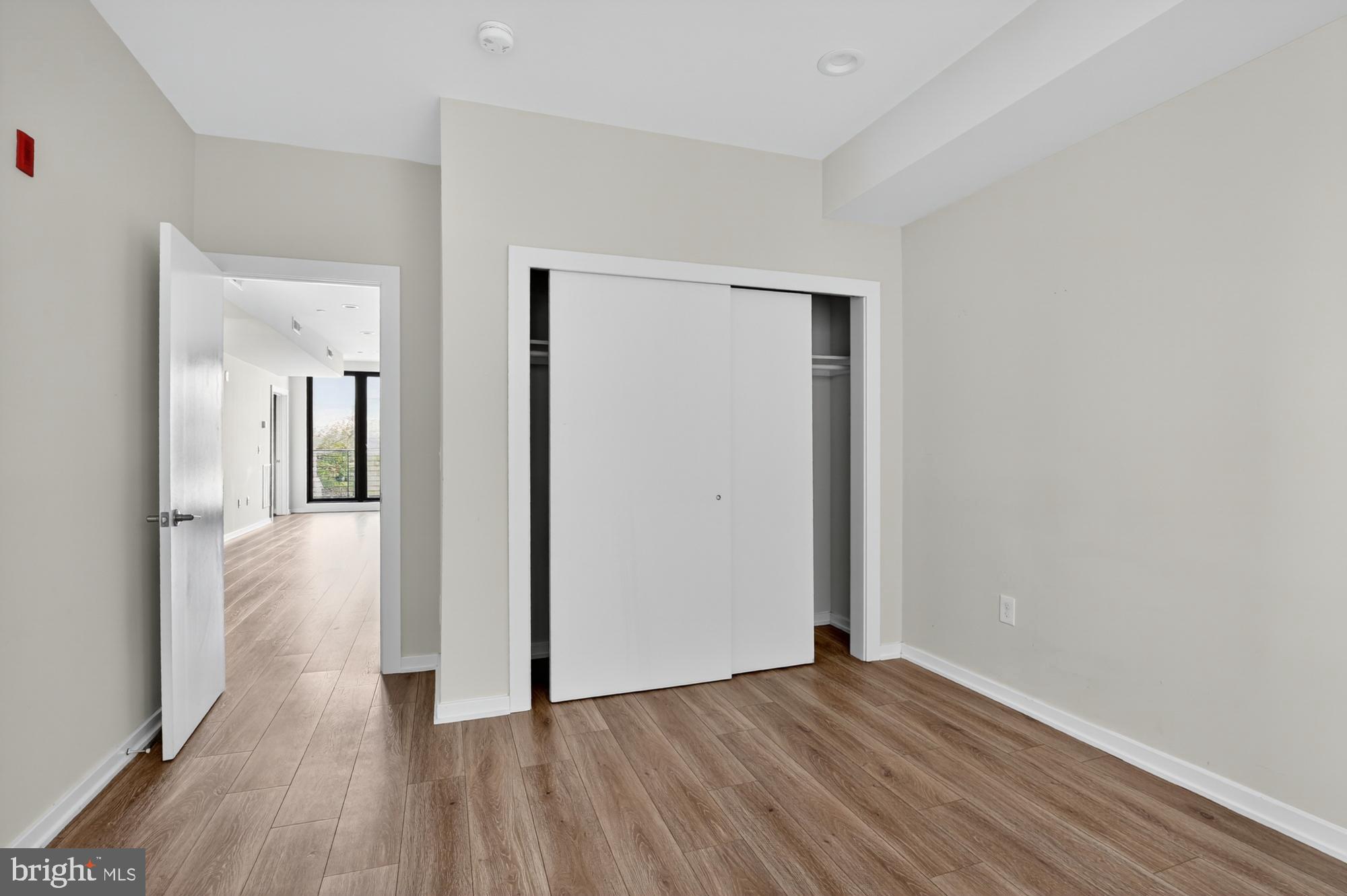 381 Martin Street, Unit 2 Philadelphia, PA 19128 - Photo 17 of 20 a view of a hallway with wooden floor