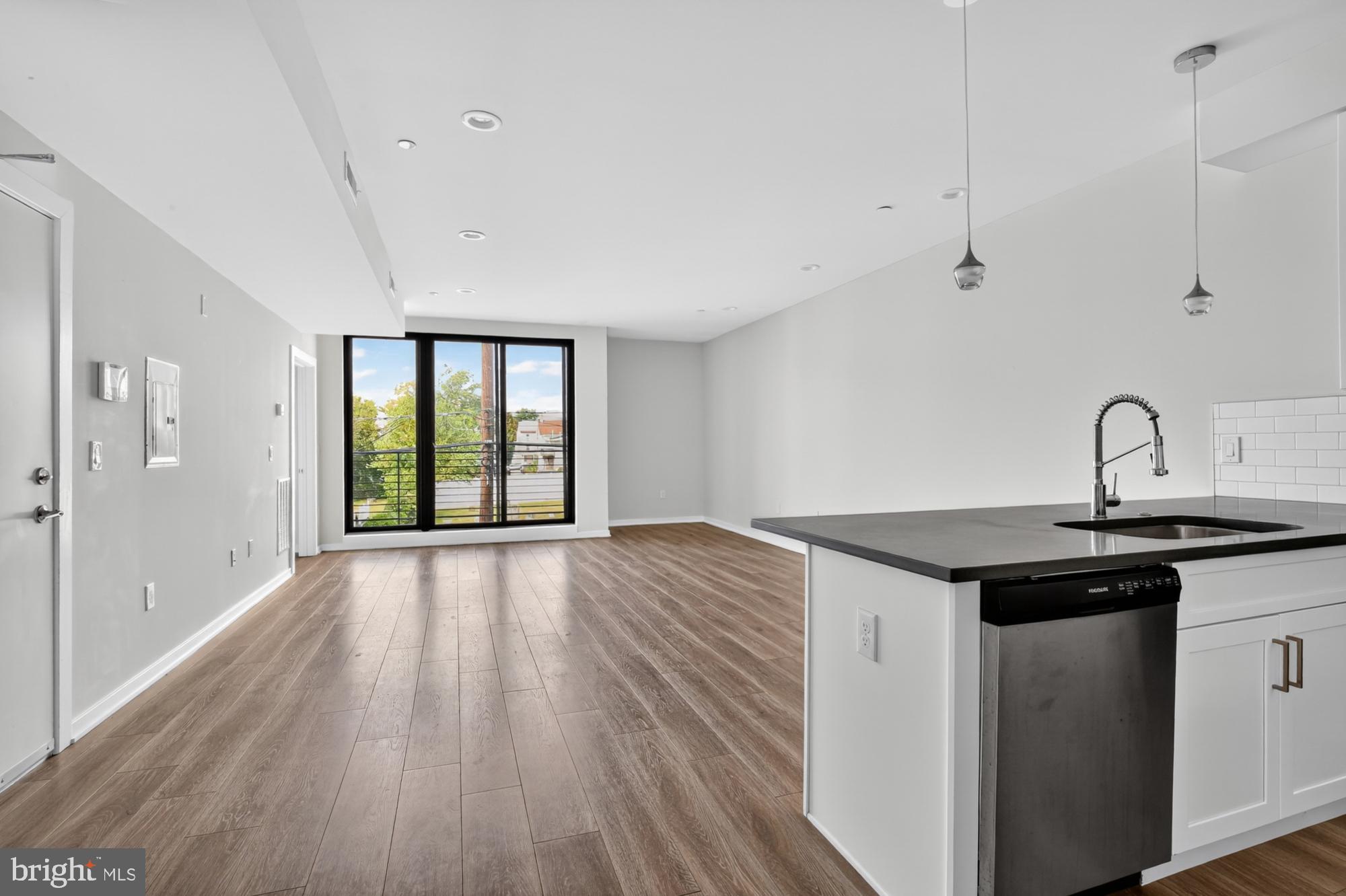 381 Martin Street, Unit 2 Philadelphia, PA 19128 - Photo 5 of 20 a kitchen with a sink and large window