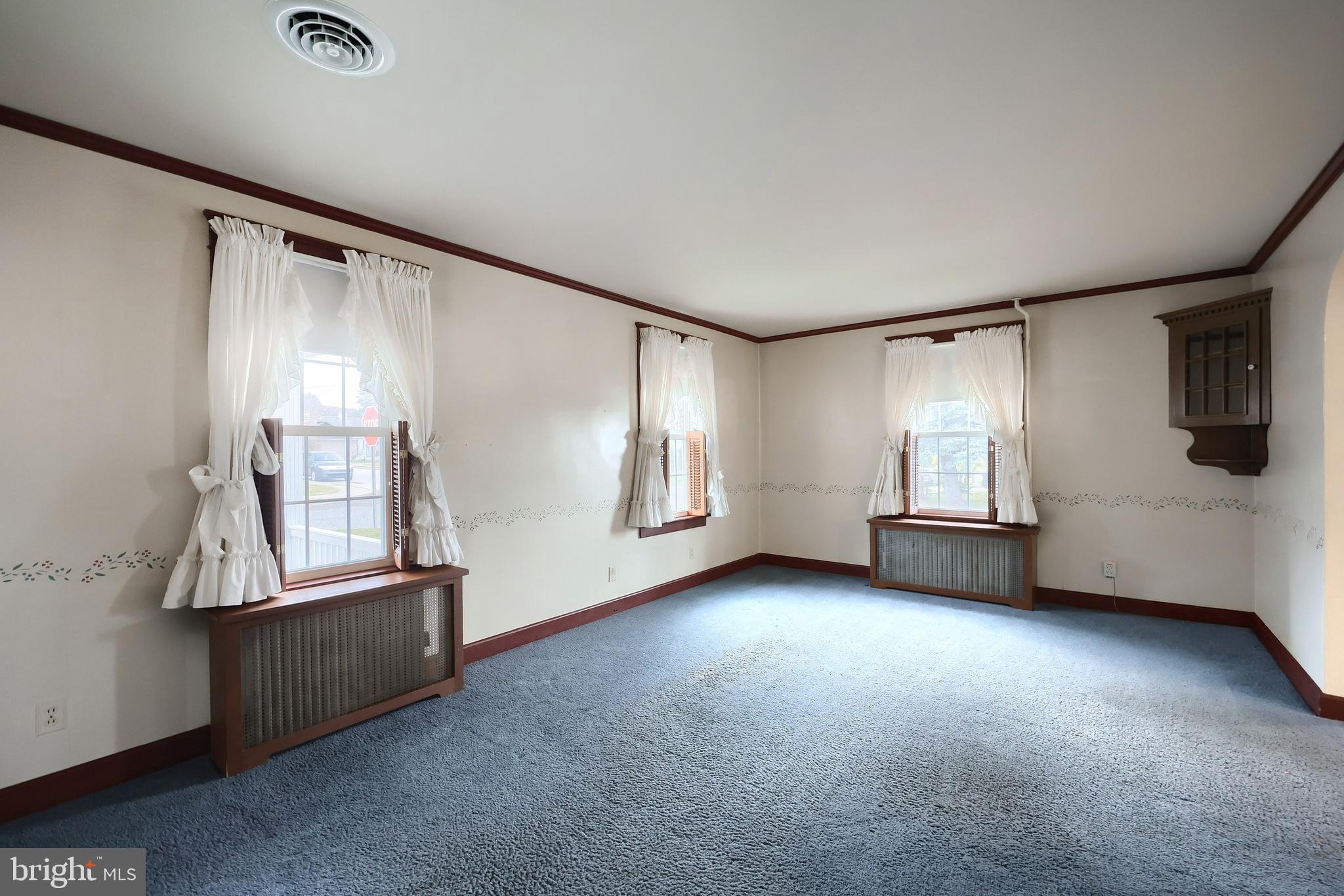 99 5th Street Hanover, PA 17331 - Photo 11 of 38 a view of an empty room with window and wooden floor