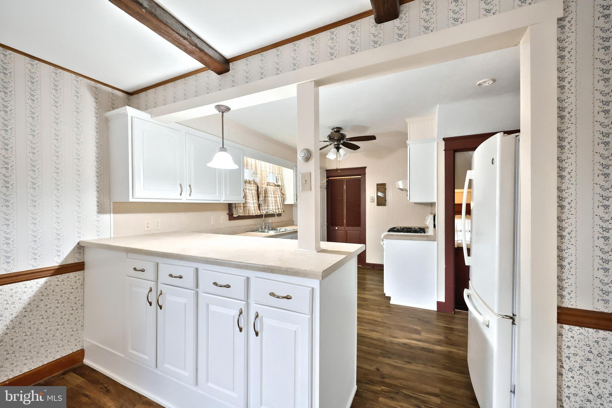 99 5th Street Hanover, PA 17331 - Photo 15 of 38 a kitchen with white cabinets and sink