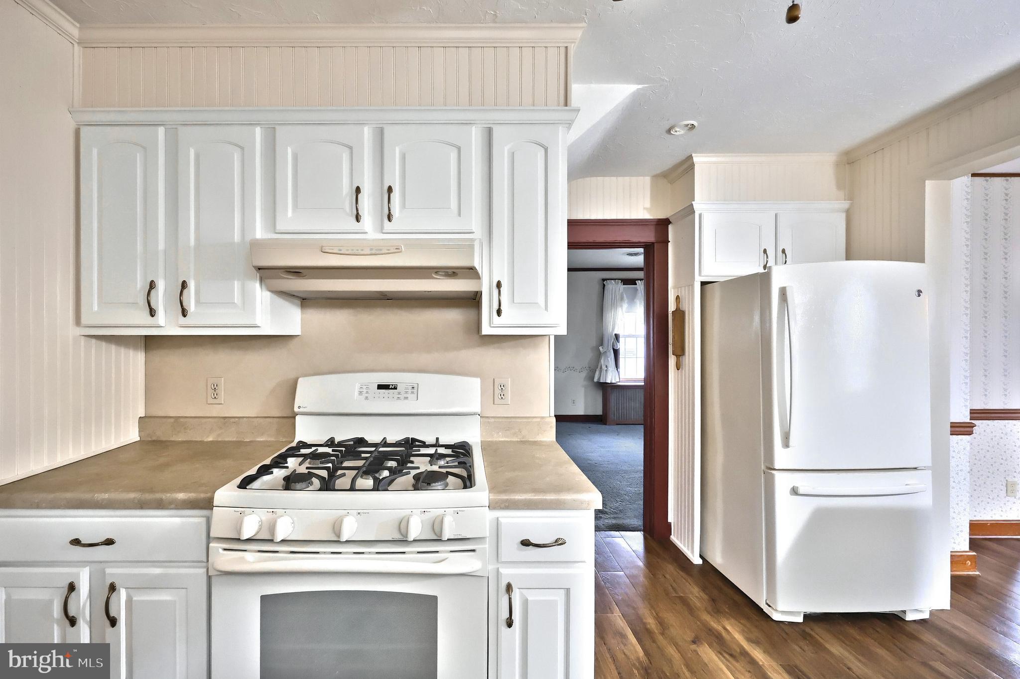 99 5th Street Hanover, PA 17331 - Photo 16 of 38 a white stove top oven sitting inside of a kitchen