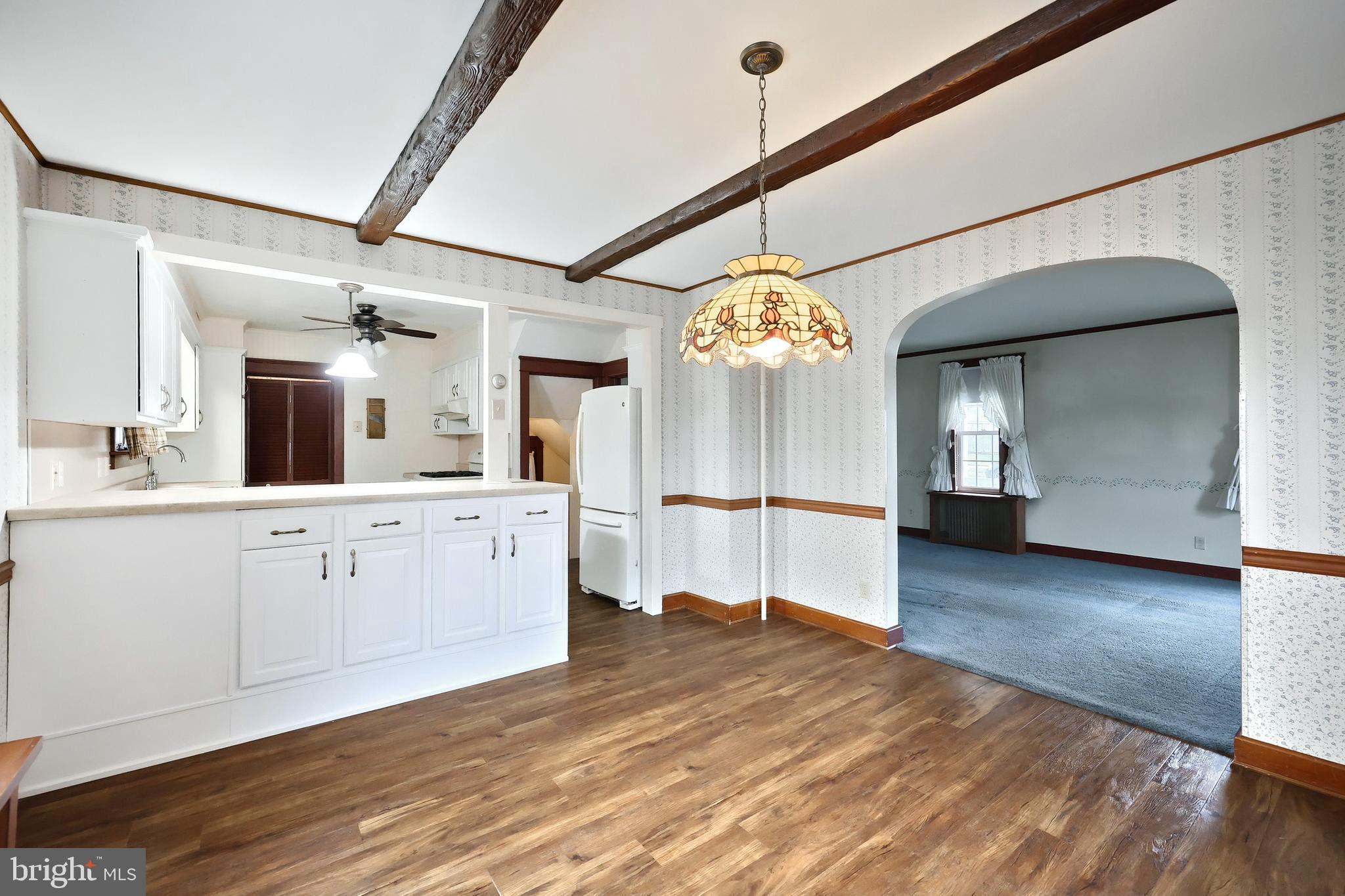 99 5th Street Hanover, PA 17331 - Photo 17 of 38 a view of a kitchen with a sink hardwood floor and a large window
