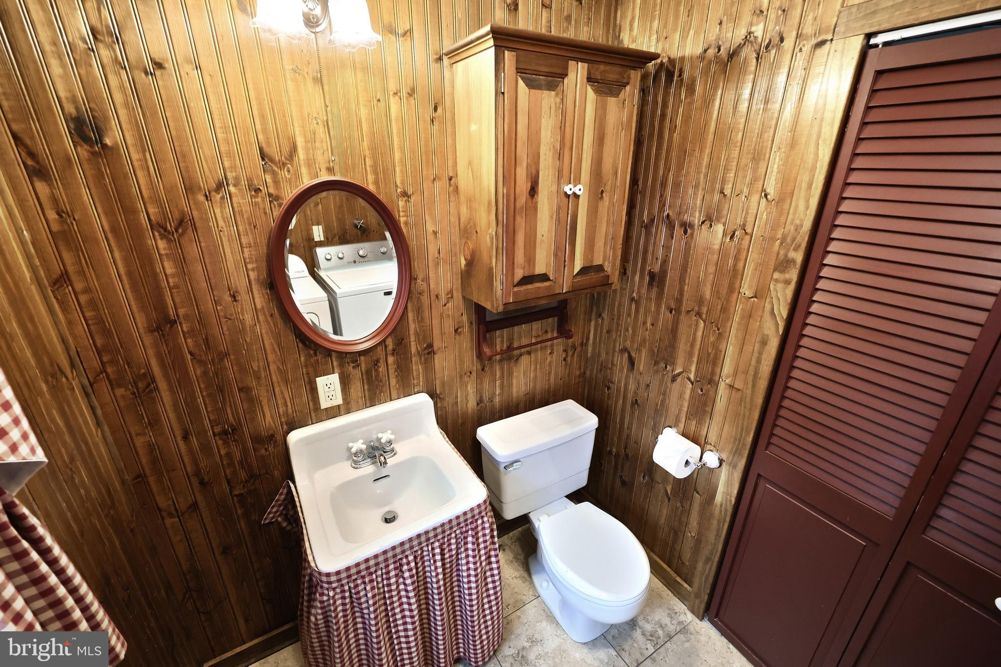 99 5th Street Hanover, PA 17331 - Photo 19 of 38 a bathroom with a toilet a sink and a shower curtain