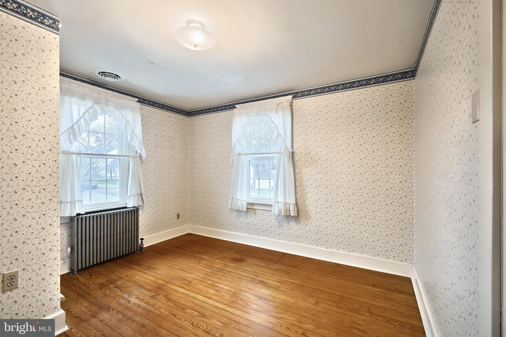 99 5th Street Hanover, PA 17331 - Photo 21 of 38 an empty room with wooden floor and windows