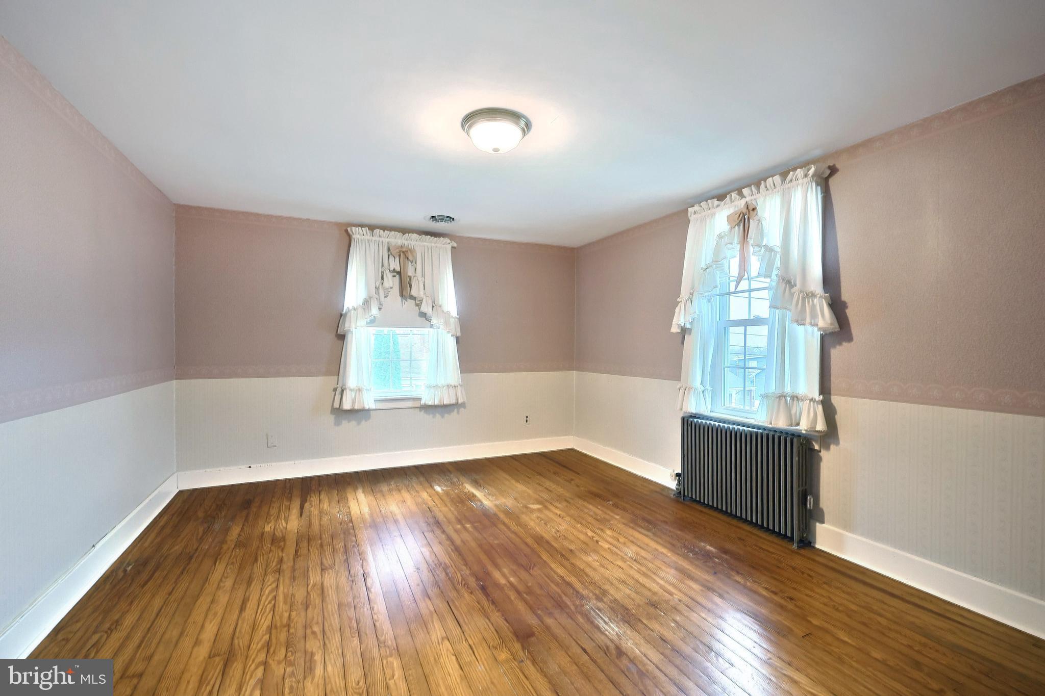 99 5th Street Hanover, PA 17331 - Photo 25 of 38 wooden floor in an empty room with a window