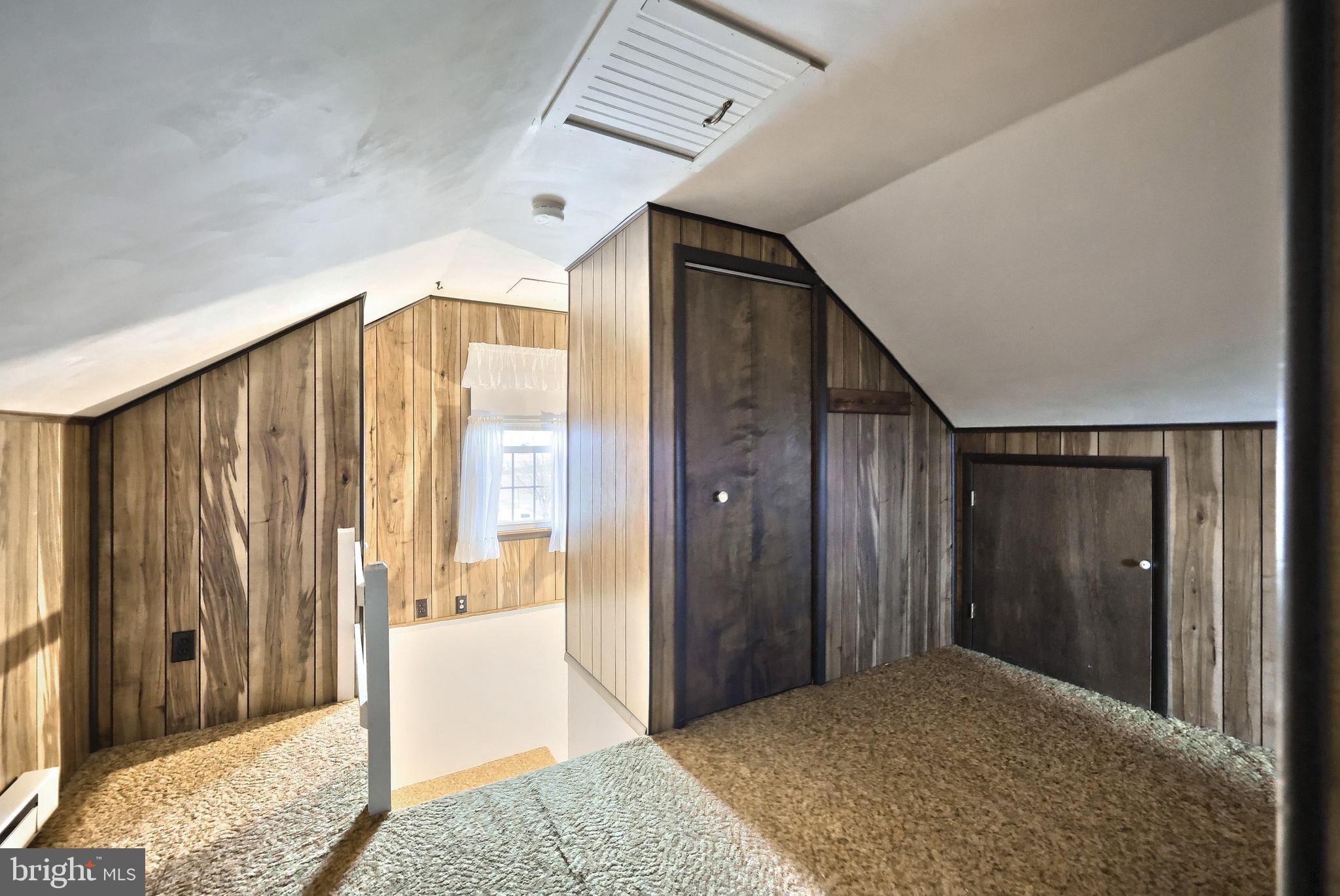 99 5th Street Hanover, PA 17331 - Photo 29 of 38 a view of a bedroom with wooden floor and a bathroom