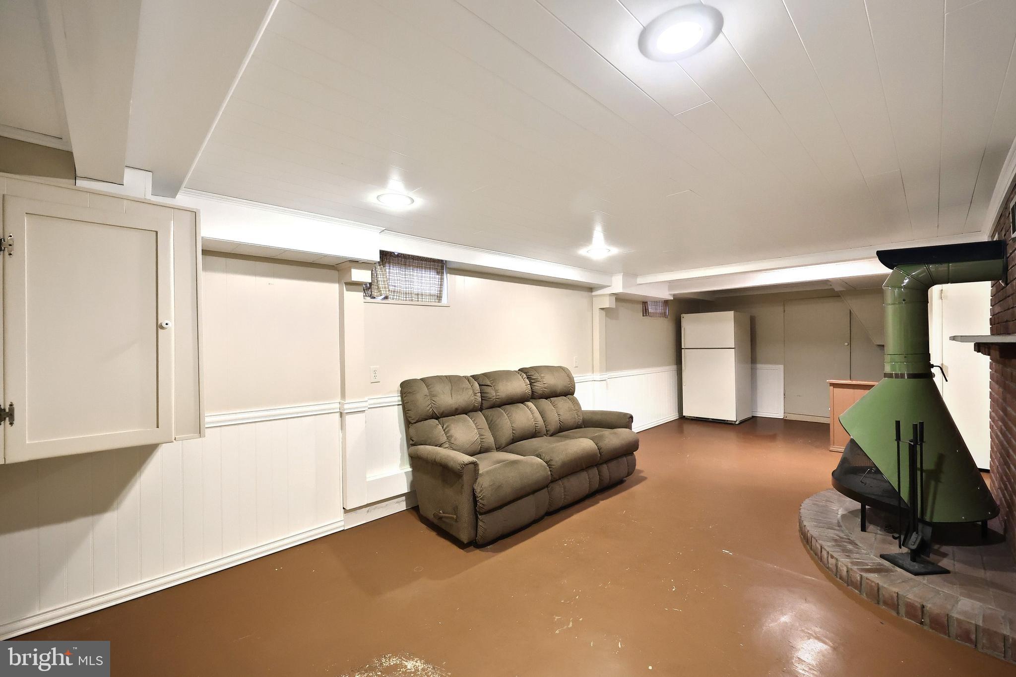 99 5th Street Hanover, PA 17331 - Photo 33 of 38 a living room with furniture and a flat screen tv