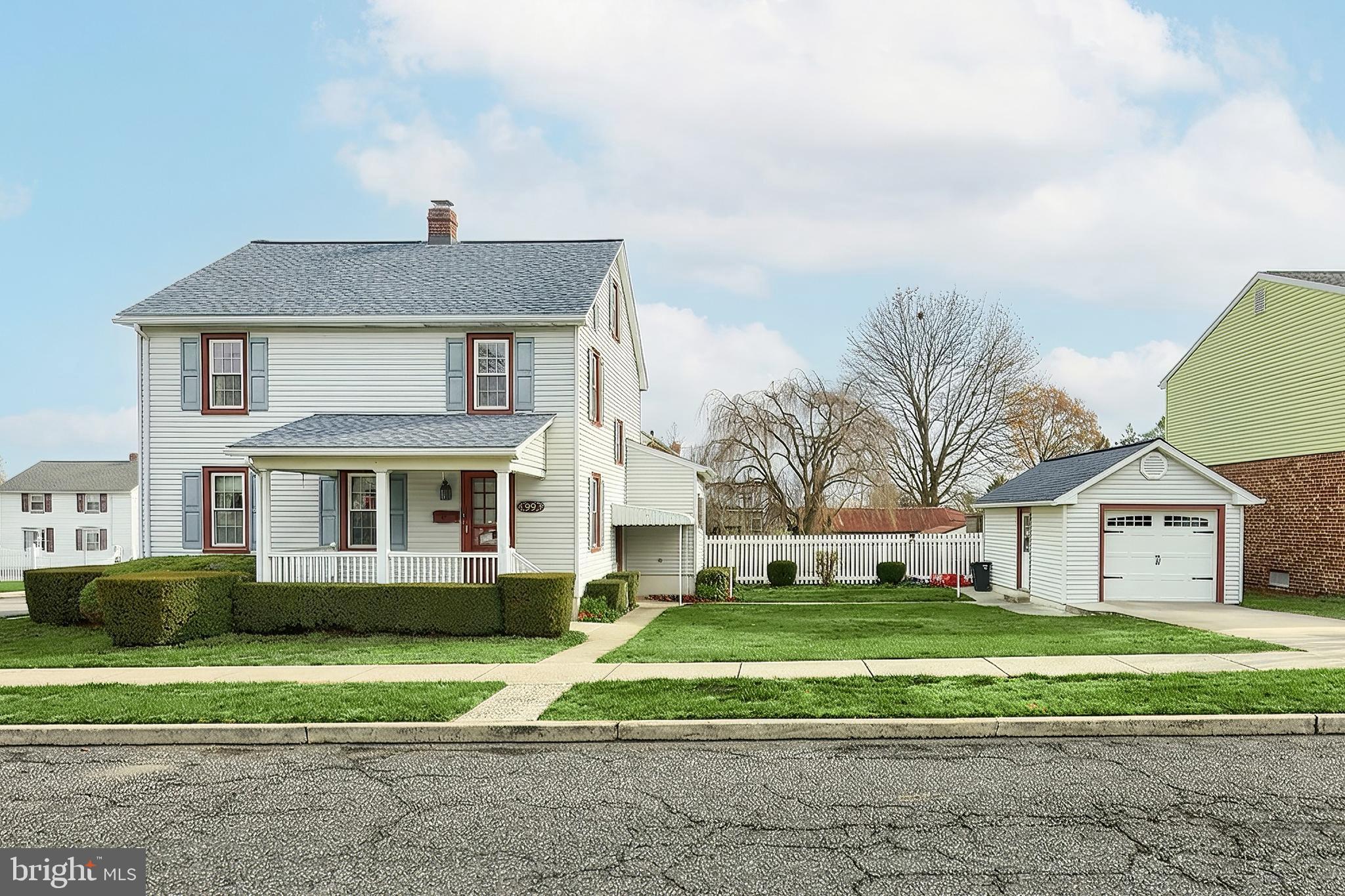 99 5th Street Hanover, PA 17331 - Photo 4 of 38 a front view of a house with a yard