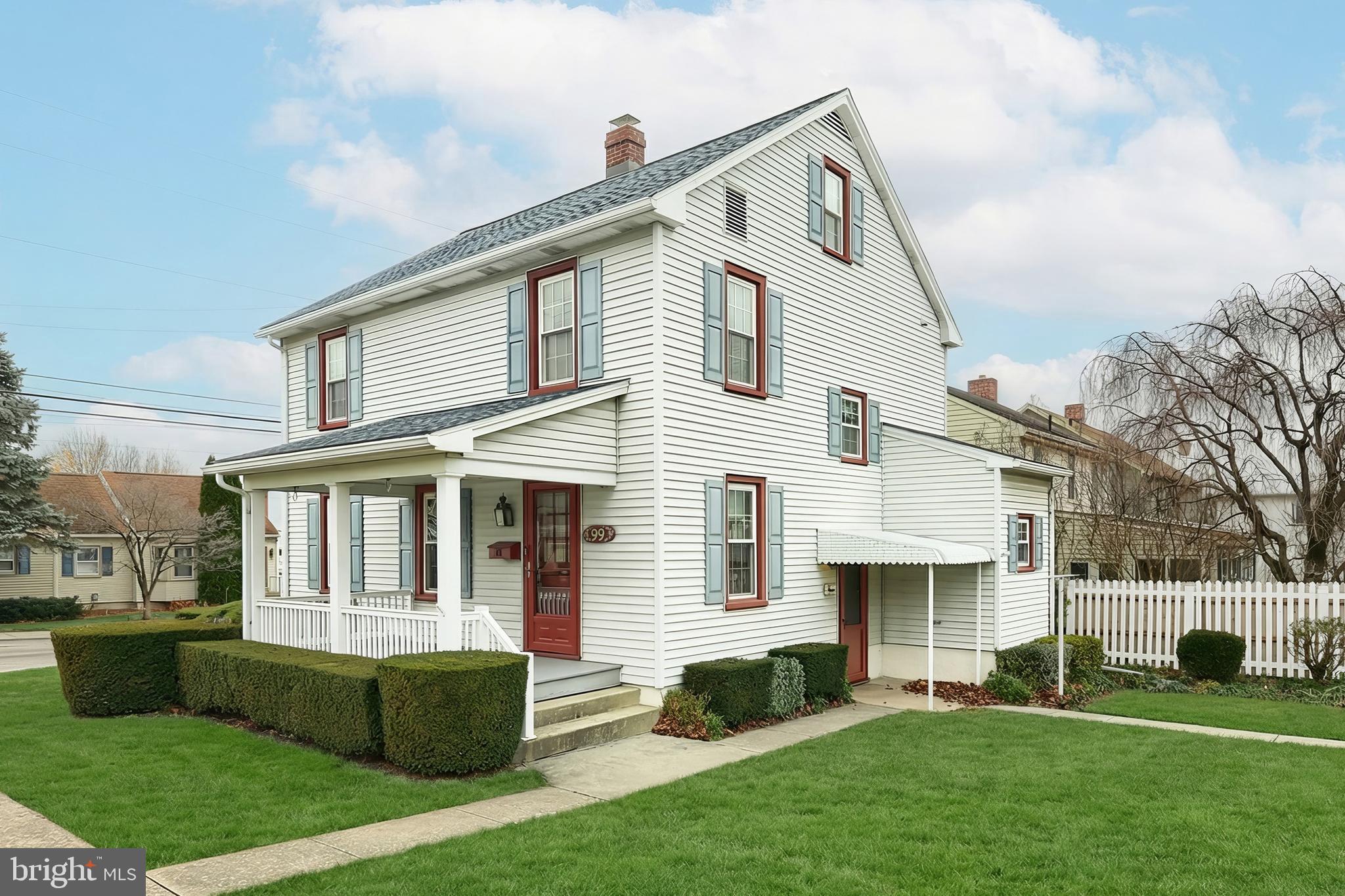 99 5th Street Hanover, PA 17331 - Photo 5 of 38 a front view of a house with a garden and plants
