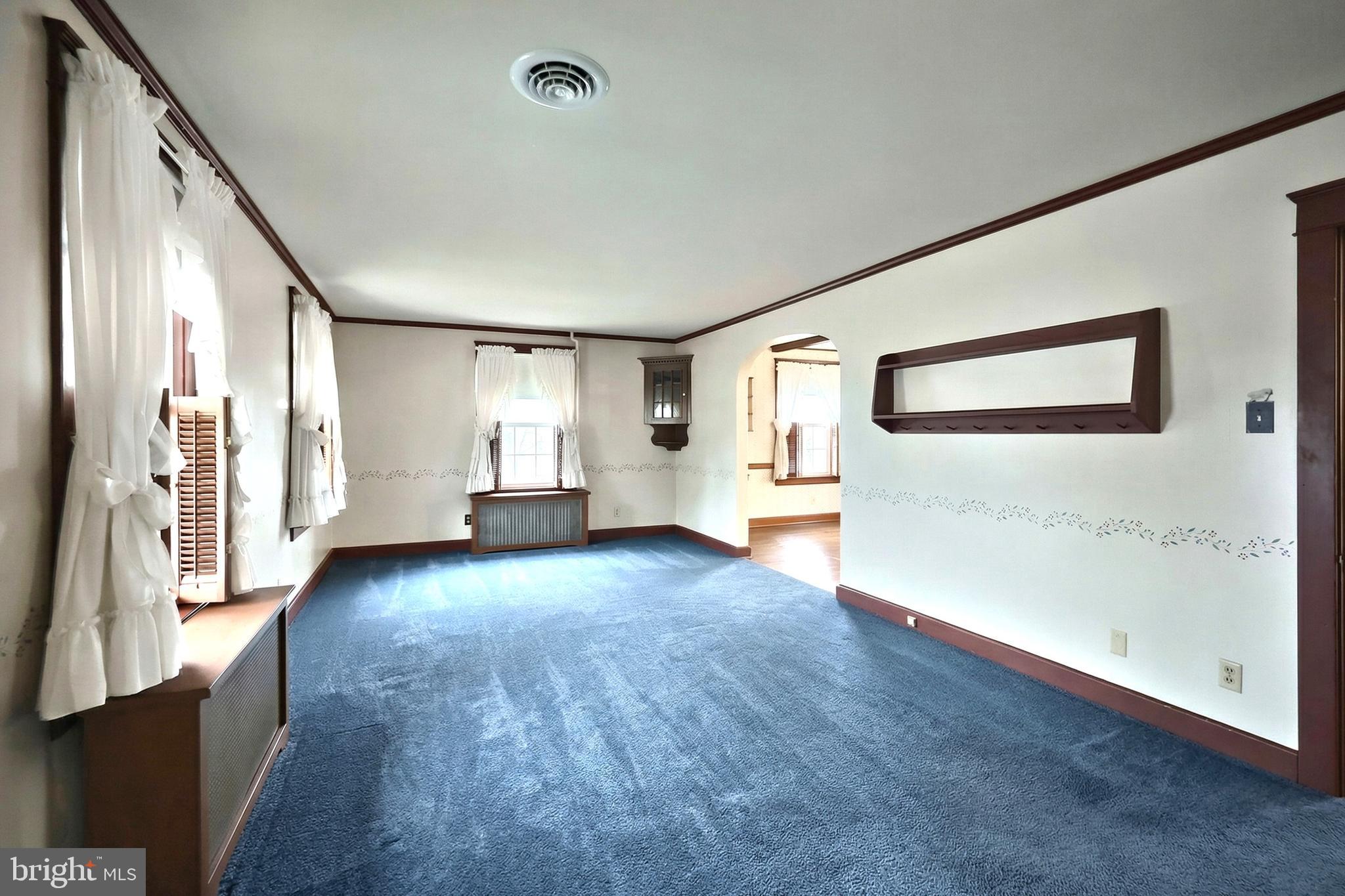 99 5th Street Hanover, PA 17331 - Photo 10 of 38 a view of a big room with wooden floor and windows