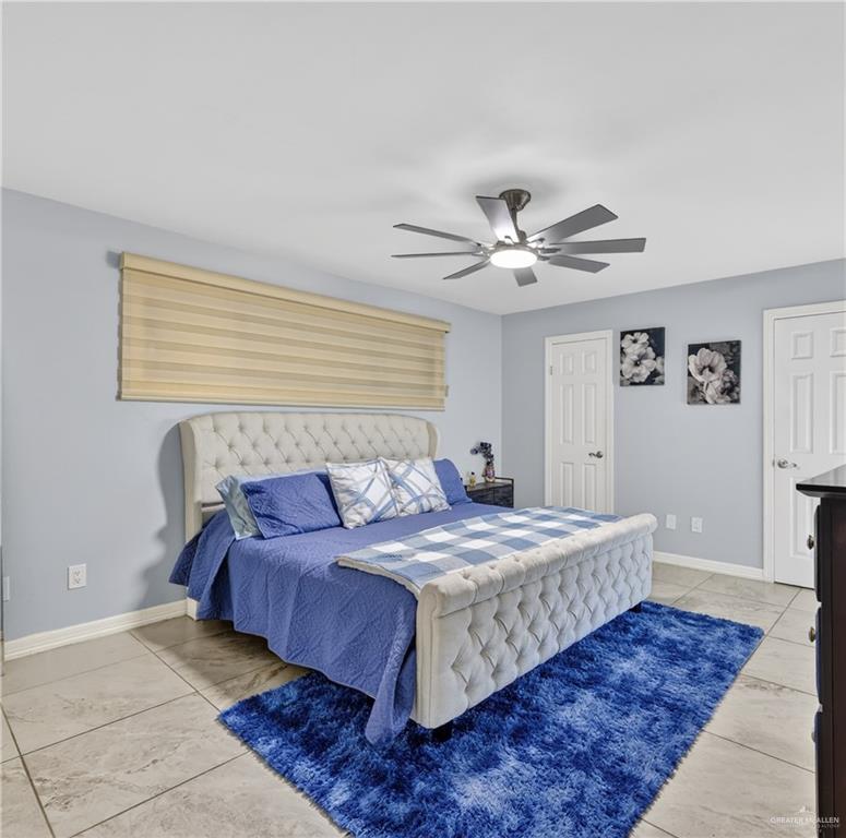 500 Wichita Avenue McAllen, TX 78503 - Photo 11 of 22 a bedroom with a large bed and a ceiling fan