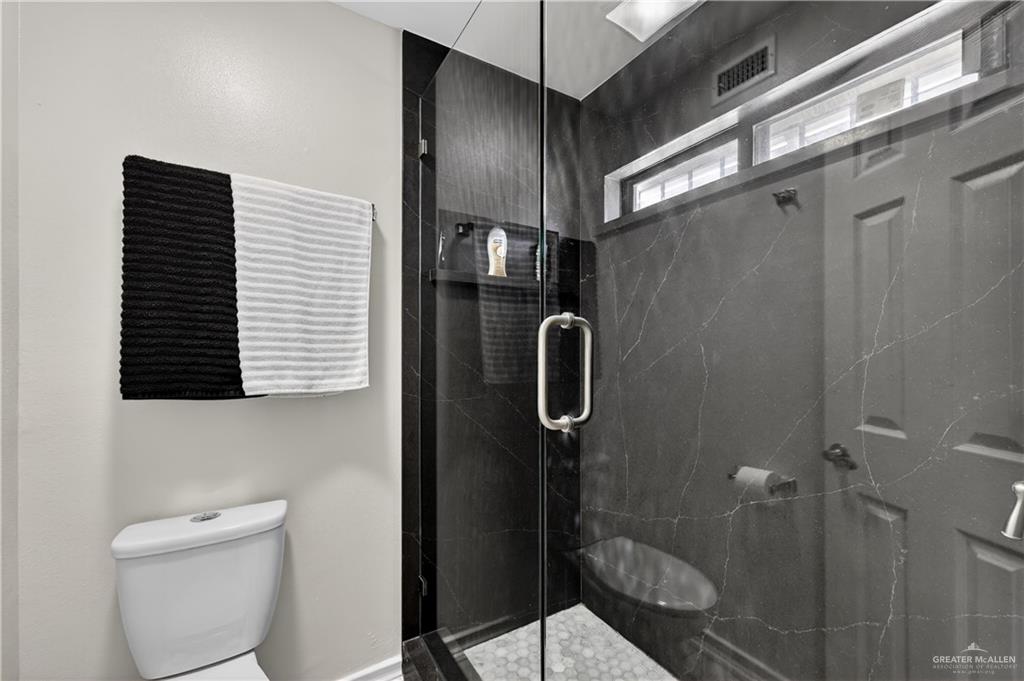 500 Wichita Avenue McAllen, TX 78503 - Photo 13 of 22 a bathroom with a shower toilet and sink