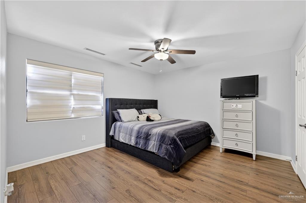 500 Wichita Avenue McAllen, TX 78503 - Photo 14 of 22 a bedroom with a bed and a tv