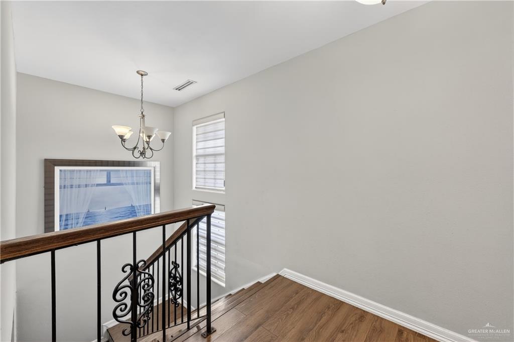 500 Wichita Avenue McAllen, TX 78503 - Photo 19 of 22 a view of a hallway with wooden floor and staircase