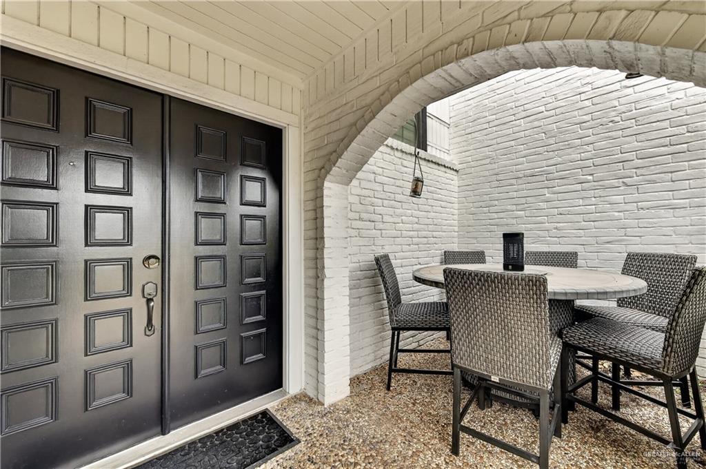 500 Wichita Avenue McAllen, TX 78503 - Photo 2 of 22 a view of a patio with table and chairs and potted plants