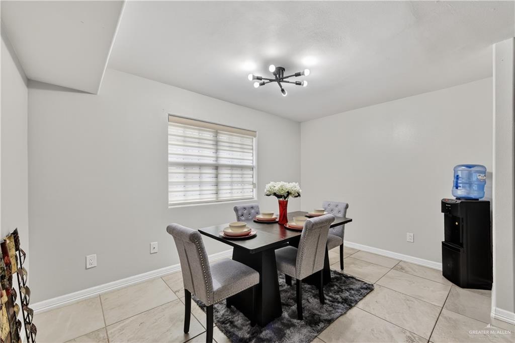 500 Wichita Avenue McAllen, TX 78503 - Photo 3 of 22 a view of a dining room with furniture and chandelier
