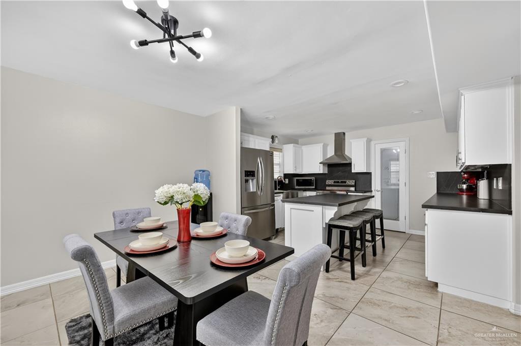500 Wichita Avenue McAllen, TX 78503 - Photo 5 of 22 a kitchen with a dining table and chairs