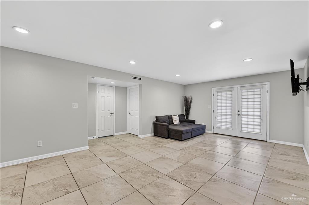 500 Wichita Avenue McAllen, TX 78503 - Photo 8 of 22 a spacious bedroom with a bed and a television