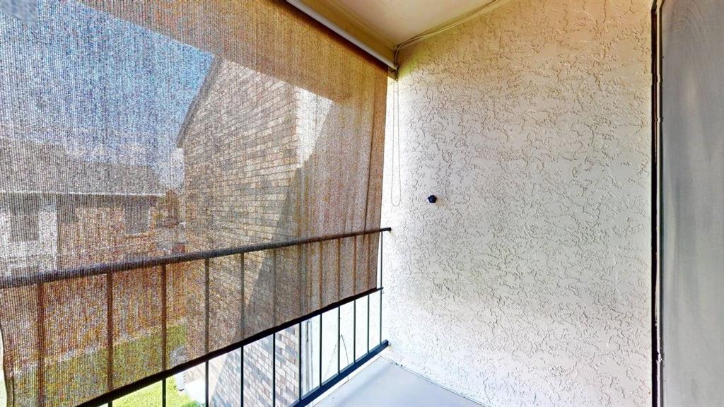 833 West Harwood Road, Unit F Hurst, TX 76054 - Photo 31 of 40 Private balcony off bedroom