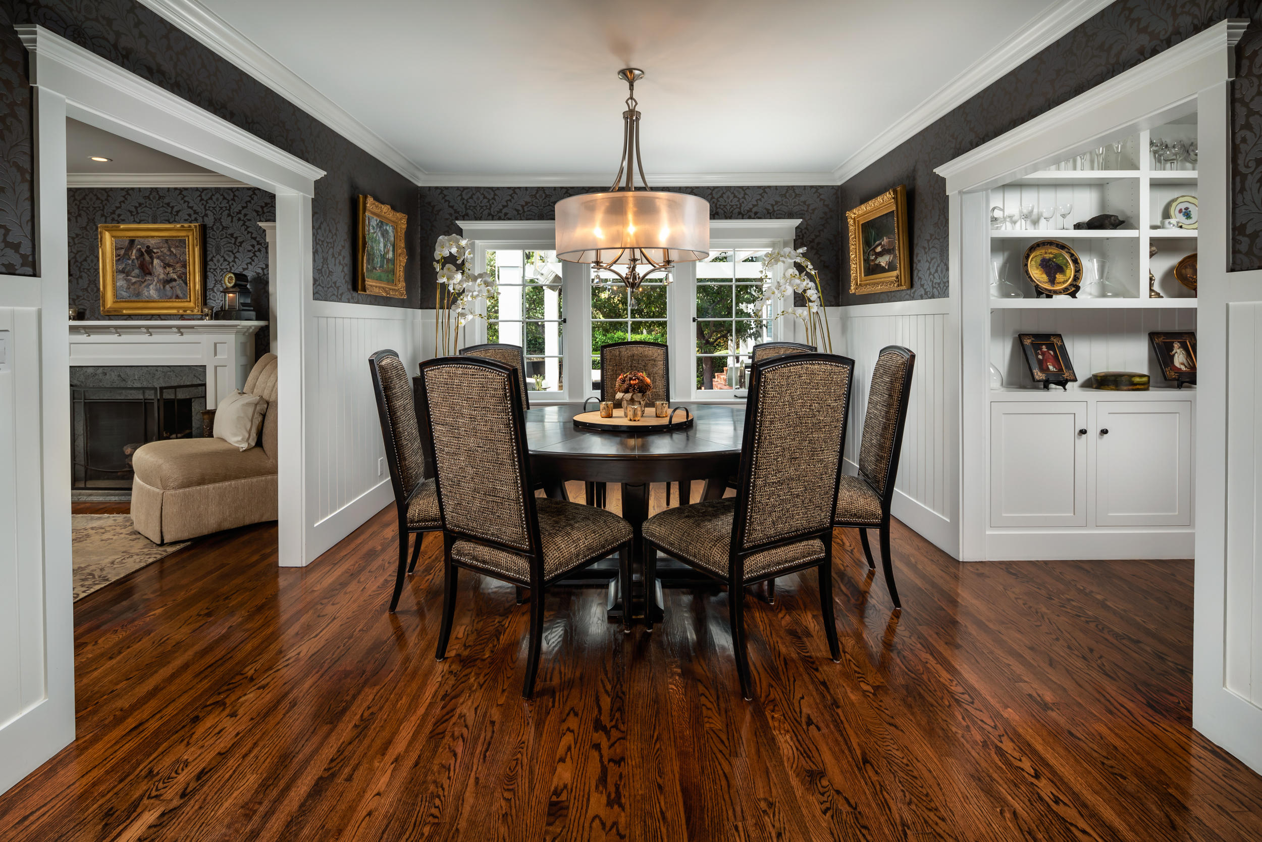 199 Ocean View Avenue Carpinteria, CA 93013 - Photo 13 of 19 a dining room with furniture a chandelier and wooden floor