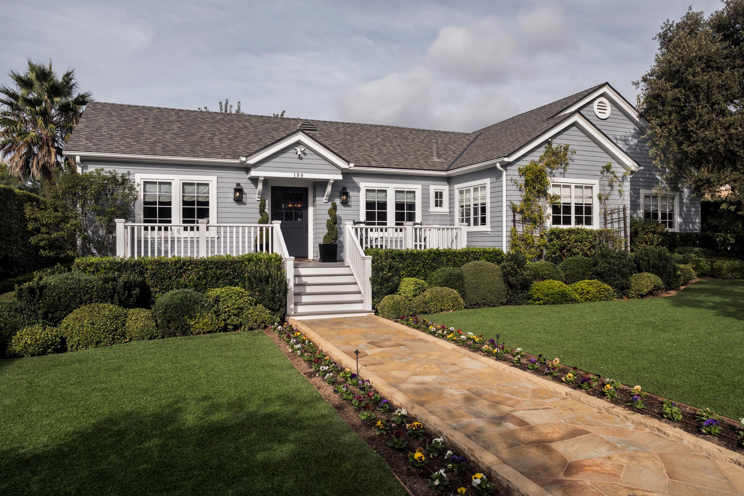 199 Ocean View Avenue Carpinteria, CA 93013 - Photo 2 of 19 a front view of a house with a yard
