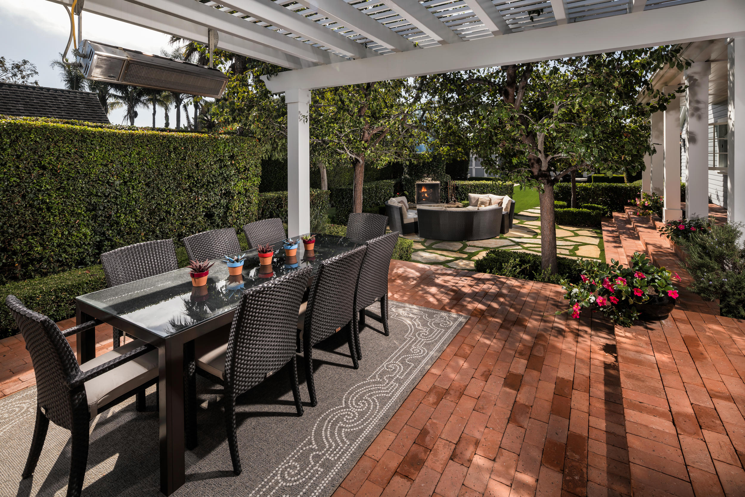 199 Ocean View Avenue Carpinteria, CA 93013 - Photo 4 of 19 a view of a patio with table and chairs and potted plants