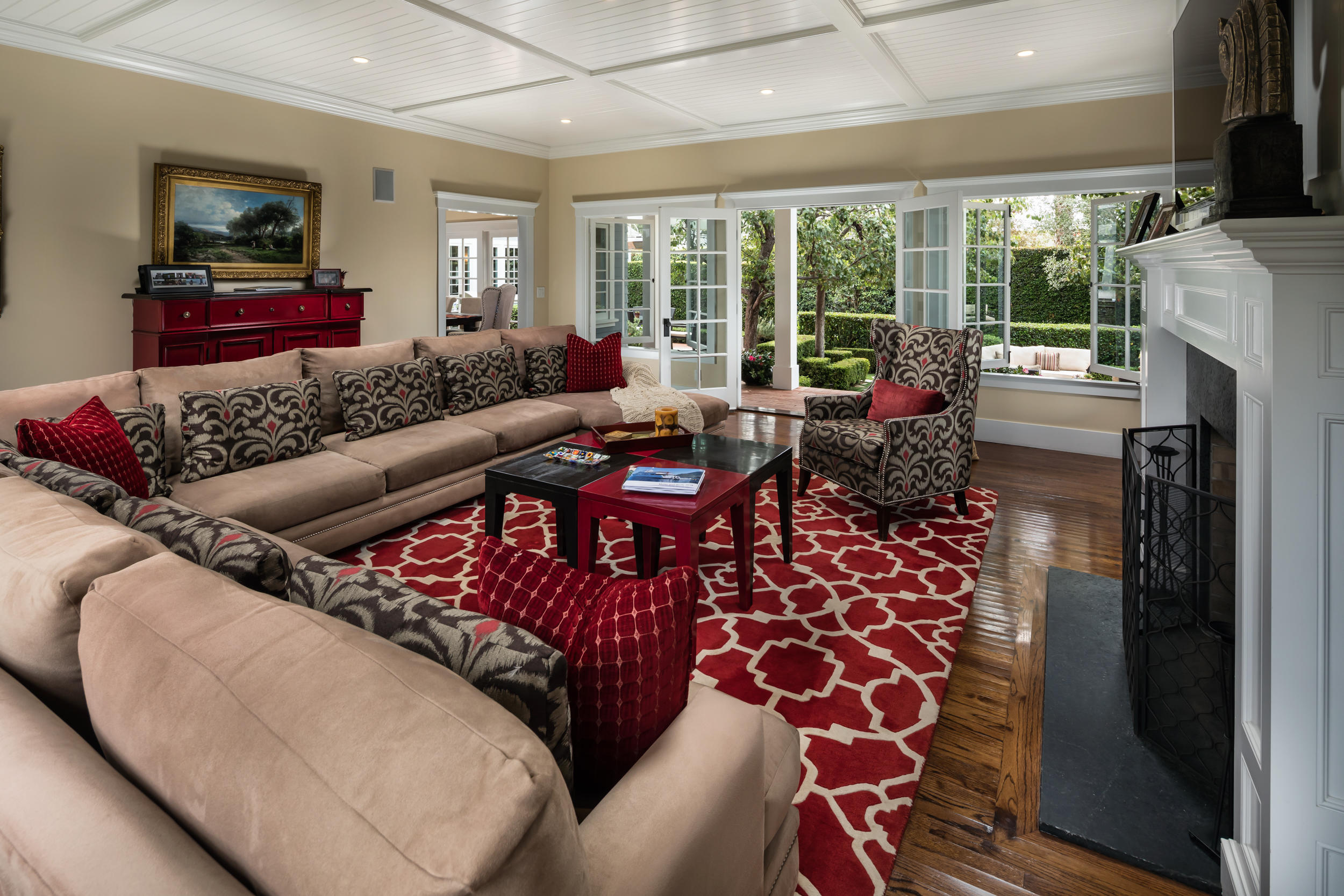 199 Ocean View Avenue Carpinteria, CA 93013 - Photo 9 of 19 a living room with furniture a flat screen tv and floor to ceiling window