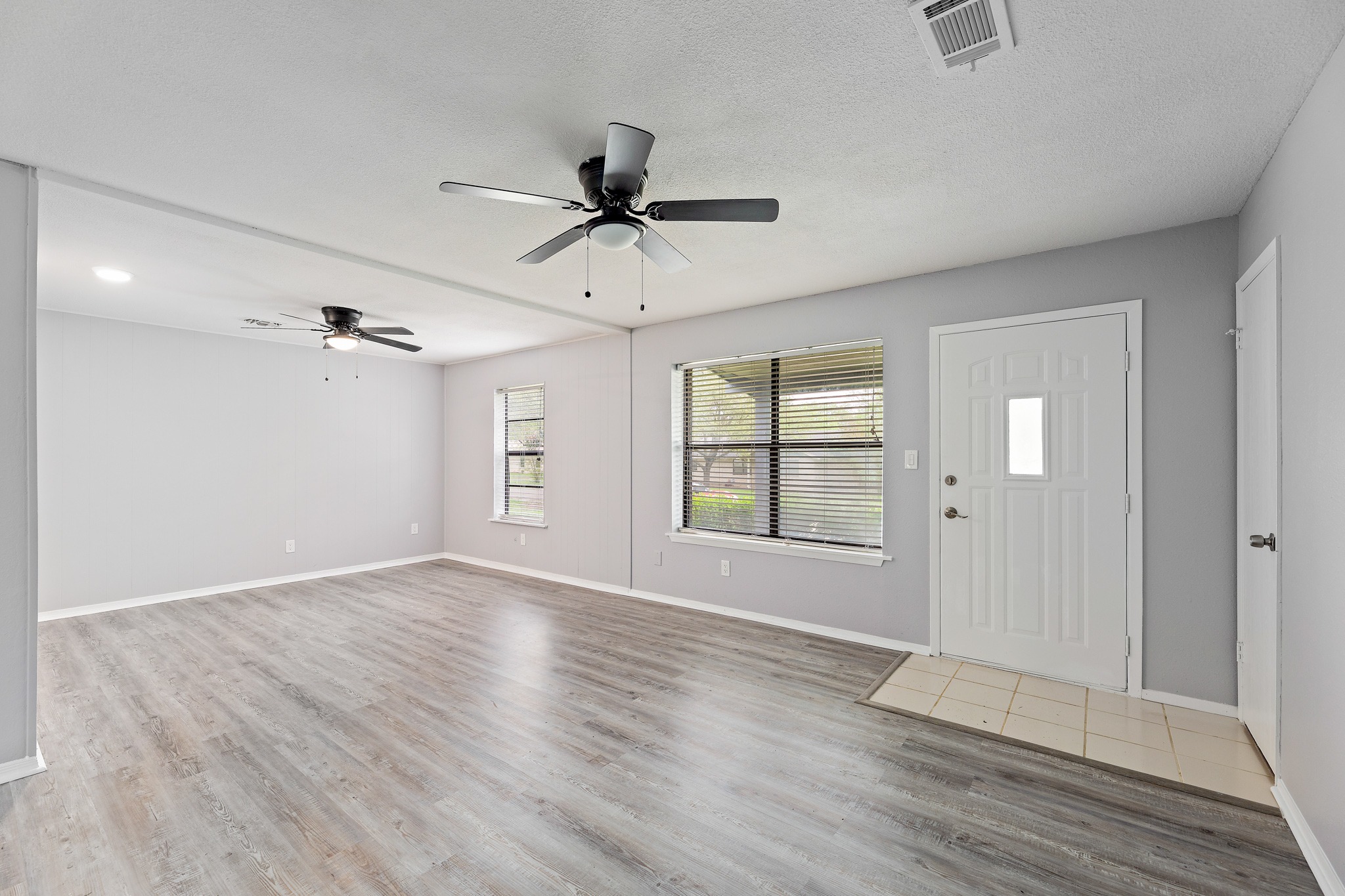 205 Hitching Post Road Kyle, TX 78640 - Photo 5 of 20 The layout feels fresh and easy with wide-plank LVP flooring throughout, no carpet anywhere.