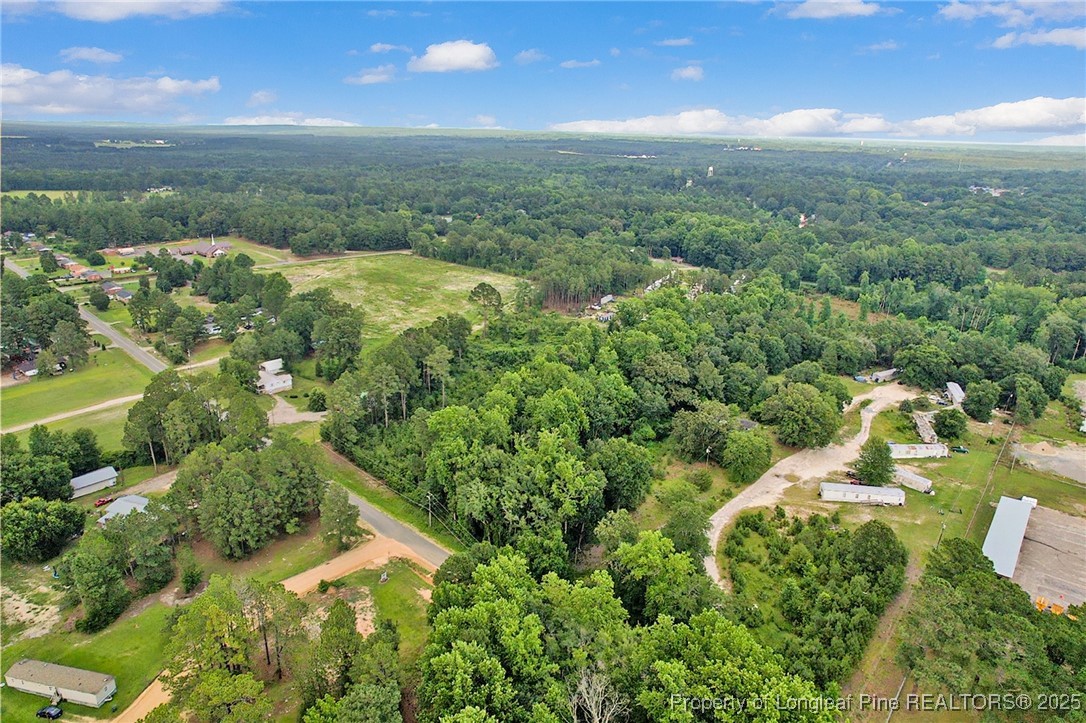 0 Mockingbird Hill Road Raeford, NC 28376 - Photo 7 of 14 an aerial view of residential houses with outdoor space and trees