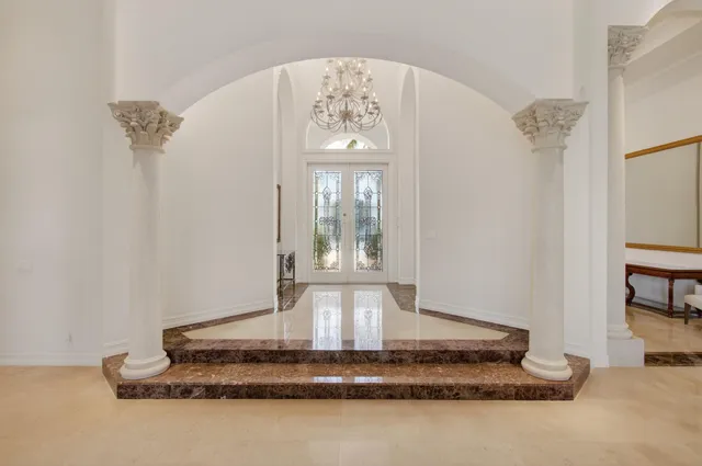 a kitchen with stainless steel appliances granite countertop a stove and a refrigerator