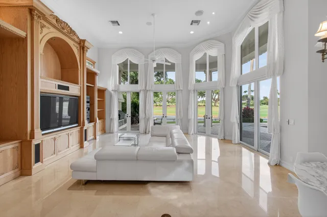 a view of a swimming pool and trees in the patio