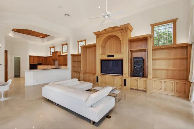 a view of a patio with table and chairs and barbeque