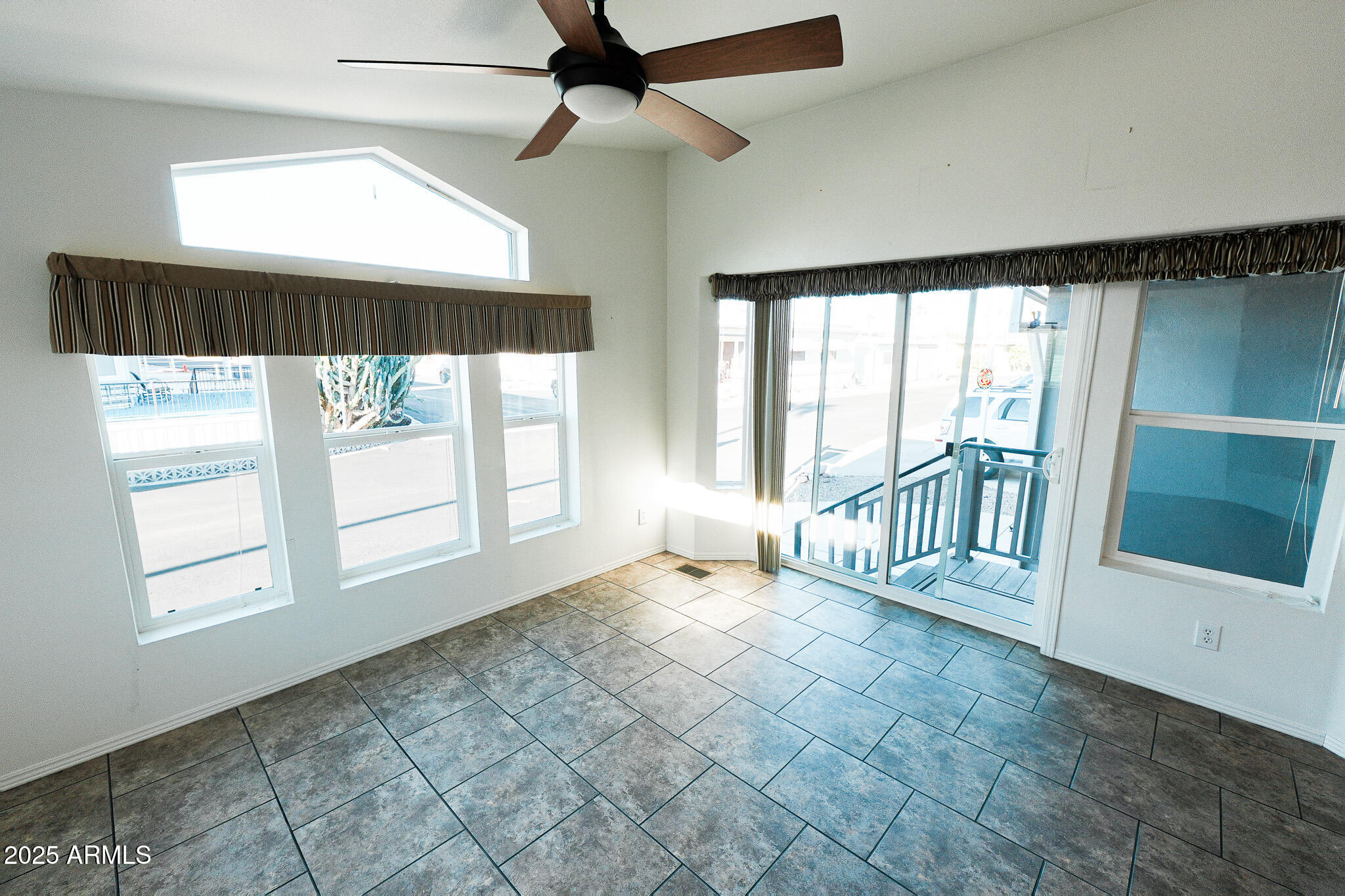 17200 West Bell Road, Unit 330 Surprise, AZ 85374 - Photo 13 of 39 a view of an empty room with a window