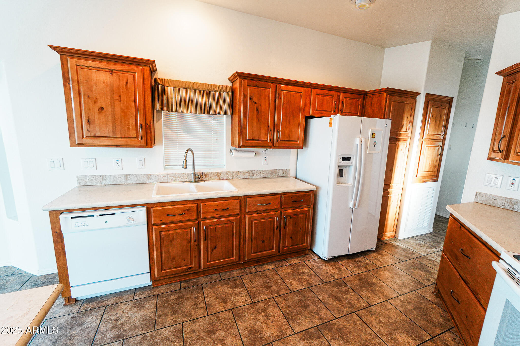 17200 West Bell Road, Unit 330 Surprise, AZ 85374 - Photo 16 of 39 a kitchen with stainless steel appliances granite countertop a refrigerator and a sink