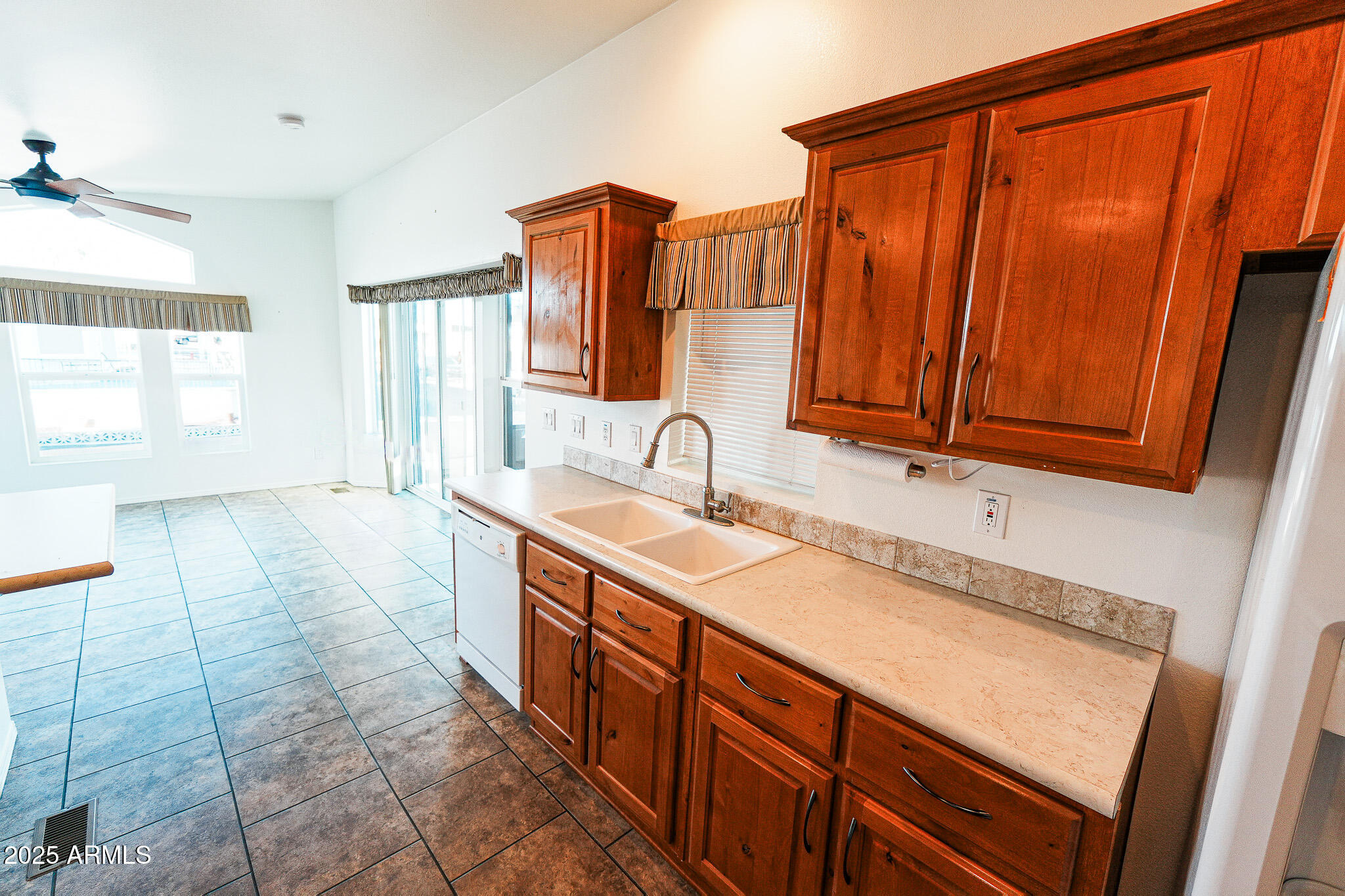 17200 West Bell Road, Unit 330 Surprise, AZ 85374 - Photo 17 of 39 a spacious bathroom with a sink a mirror and a shower