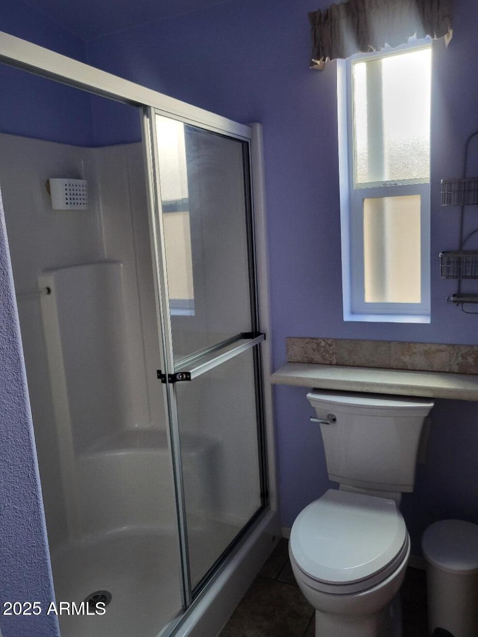 17200 West Bell Road, Unit 330 Surprise, AZ 85374 - Photo 18 of 39 a white toilet sitting next to a bathroom sink