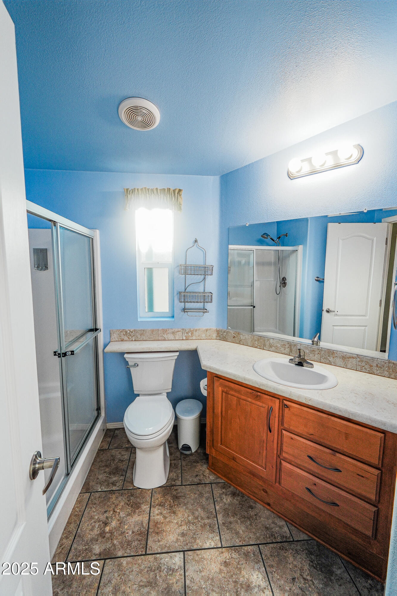 17200 West Bell Road, Unit 330 Surprise, AZ 85374 - Photo 19 of 39 a bathroom with a sink toilet and a mirror