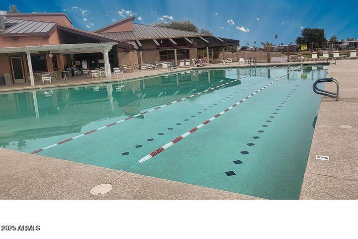 17200 West Bell Road, Unit 330 Surprise, AZ 85374 - Photo 29 of 39 a front view of a house with a garden